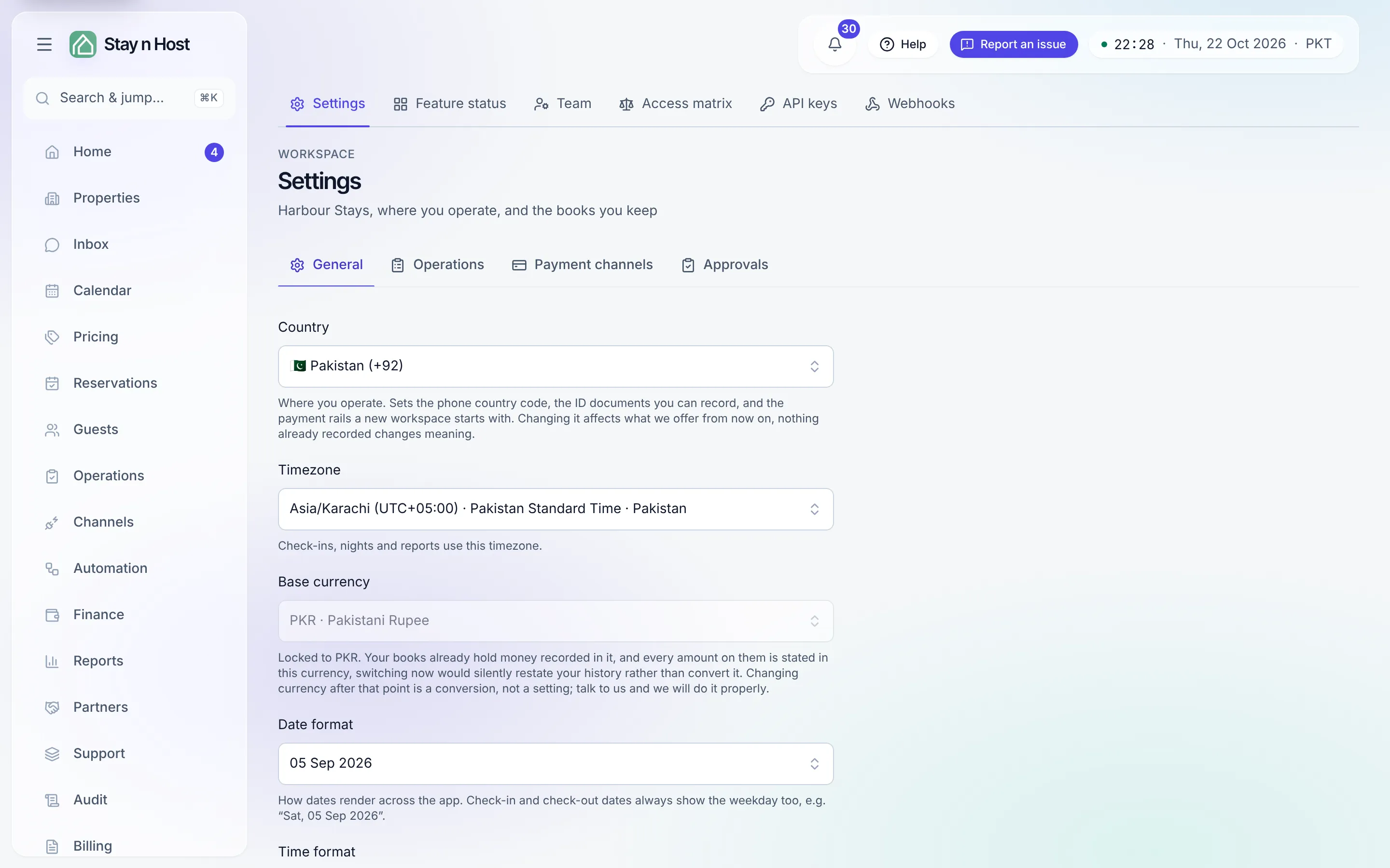 Setup → Settings on the General tab, with the four-tab strip (General, Operations, Payment channels, Approvals): country, timezone, base currency, formats, and the letterhead card